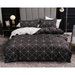 Parure de lit forme géométrique, bonne qualité et très confortable sur un lit dans une maison