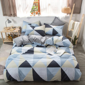 Parure de lit imprimé géométrique, bonne qualité, confortable et à la mode sur un lit dans une maison