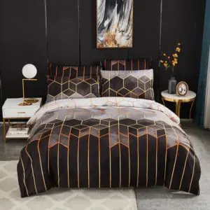 Parure de lit géométrique noir. Bonne qualité, confortable et à la mode sur un lit dans une maison