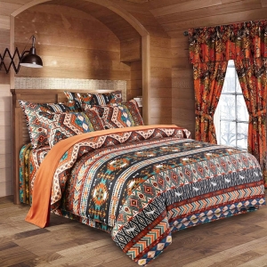 Parure de lit formes géométriques multicolores, bonne qualité et à la mode sur un lit dans une maison, très à la mode et confortable
