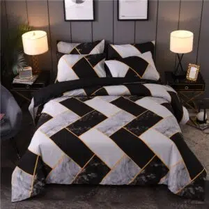 Parure de lit noir et blanche à motifs géométriques. Bonne qualité, confortable et à la mode sur un lmit dans une maison