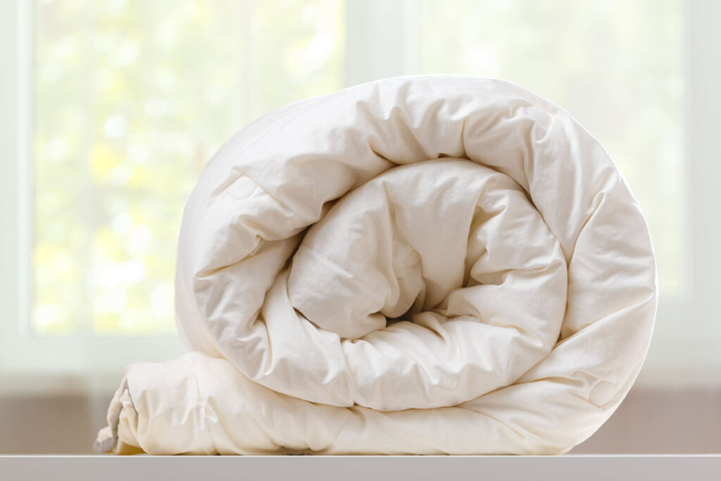 Couette pliée avant le lavage