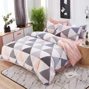 Parure de lit multicolore en coton à motif géométrique. Bonne qualité, confortable et à la mode sur un lit dans une maison