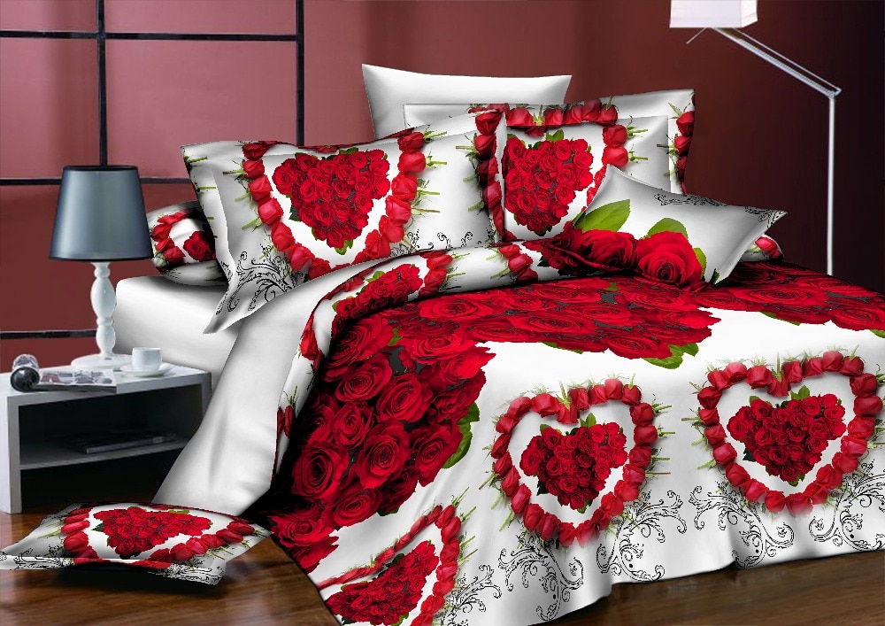 Parure de lit blanche à motif cœurs rouges. Bonne qualité, confortable et à la mode sur un lit dans une maison