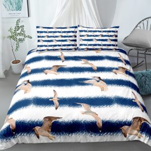 Parure de lit à rayures bleu et blanc à motif oiseaux. Bonne qualité, confortable et à la mode sur un lit dans une maison