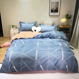 Parure de lit bleu royal à motifs géométriques. Bonne qualité, confortable et à la mode sur un lit dans une maison