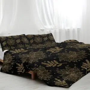 Parure de lit noir à motif feuilles dorées. Bonne qualité, confortable et à la mode sur un lit dans une maison