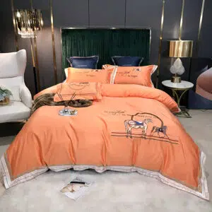 Parure de lit orange à motif cheval élégant. Bonne qualité, confortable et à la mode sur un lit dans une maison
