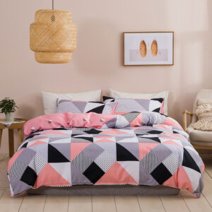 Parure de lit scandinave rose installée sur u lit dans une chambre