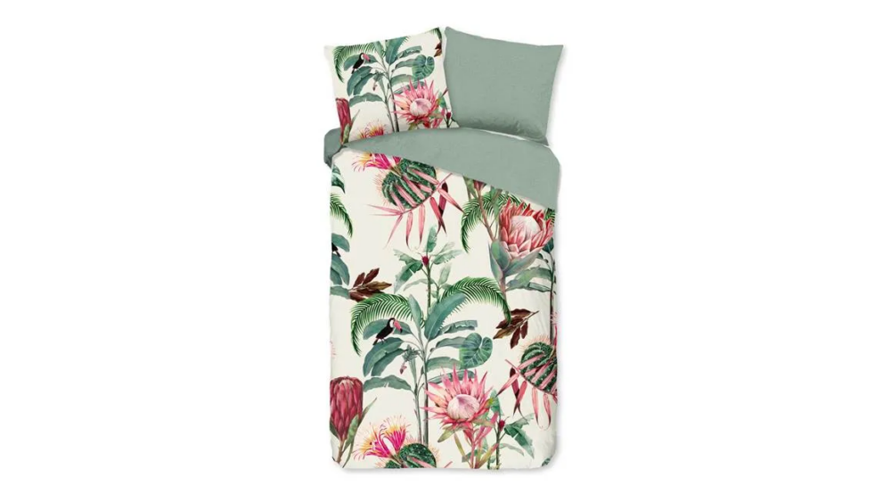 Parure de lit beige motif tropicale avec un fond blanc