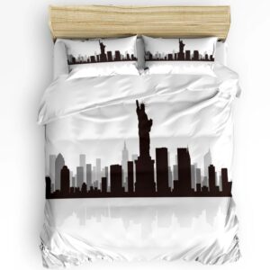Parure de lit New York minimaliste représentant la statue de liberté et des buildings en noir sur fond blanc. Sur un lit double avec deux coussins assortis.
