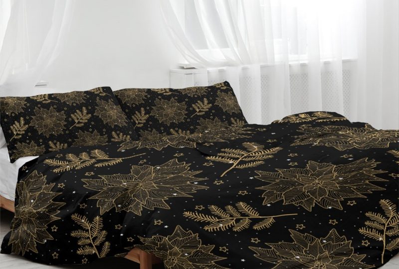 Parure de lit noir à motif feuilles dorées. Bonne qualité, confortable et à la mode sur un lit dans une maison