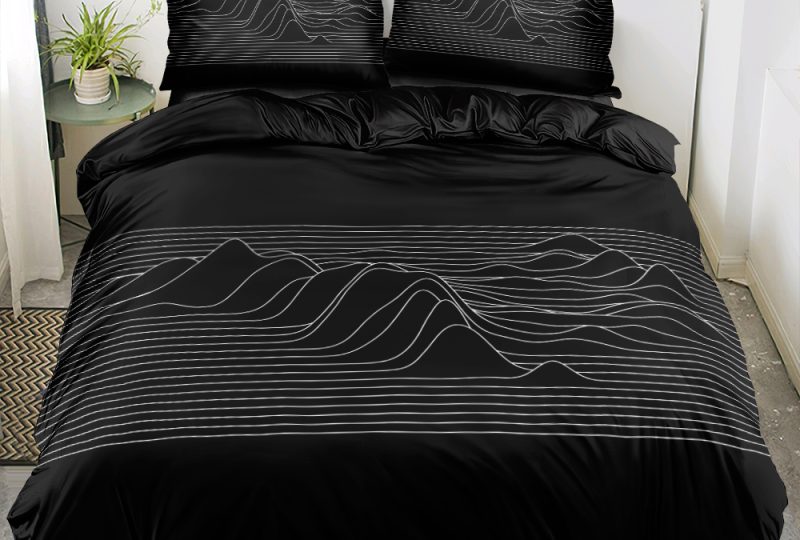 Parure de lit scandinave noire avec relief montagnes en 3D installée dans une chambre