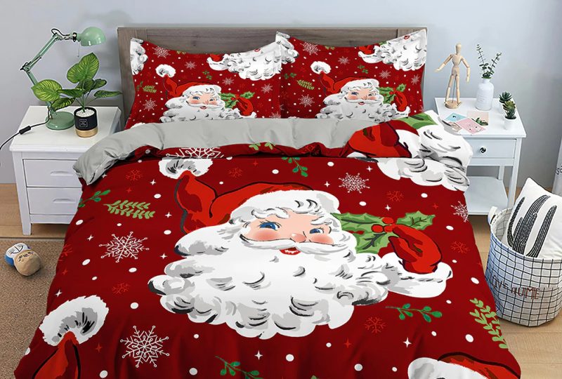 Parure de lit de Noël imprimée père noël et bonhomme de neige. Bonne qualité, confortable et à la mode sur un lit dans une maison